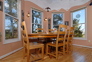 dinning room table with a mountain window view