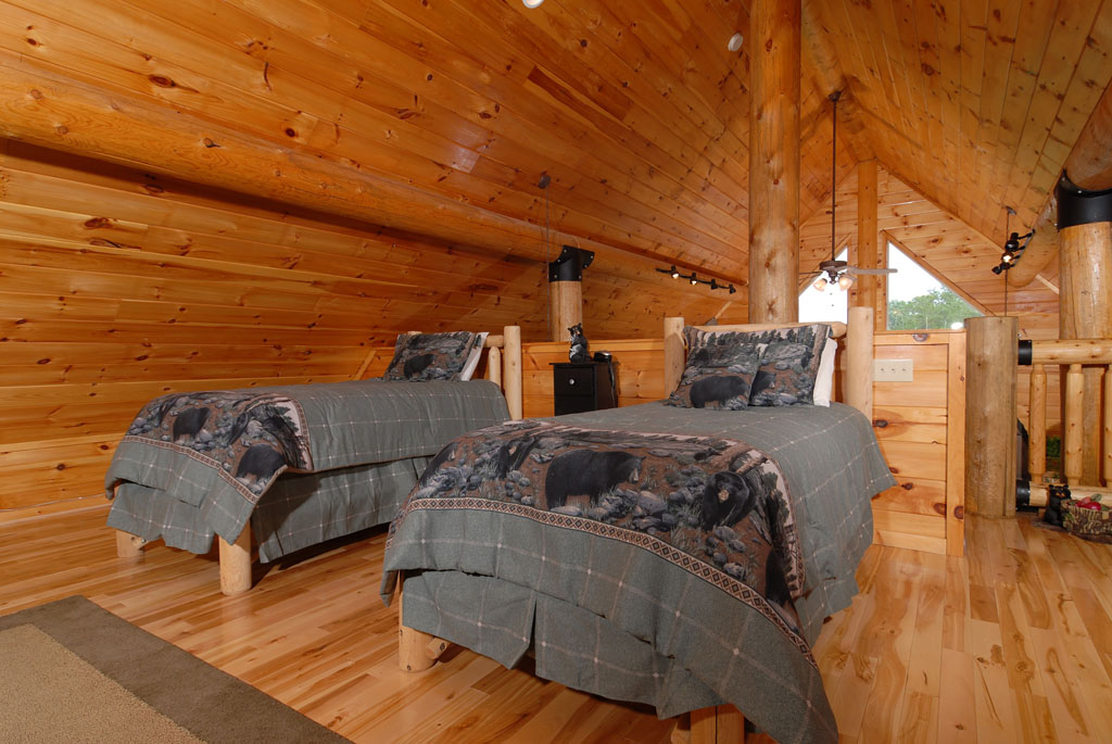 Pigeon Forge Cabin that features twin beds in the upper level loft area