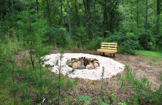 Pigeon Forge Cabin that offers an outdoor firepit area nestled in the Great Smoky Mountains.
