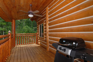 Pigeon Forge Cabin that features an outdoor cooking grill