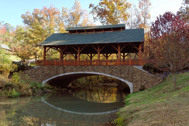 Covered bridge over a peaceful river