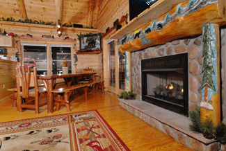 Large, elegantly carved mantle piece is the highlight of the living area