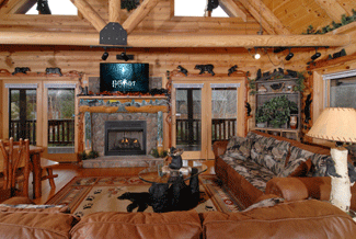 Living room with beamed ceilings and a large flat screen TV