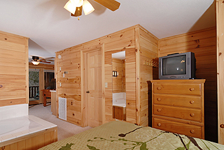 cabin bedroom with a jacuzzi