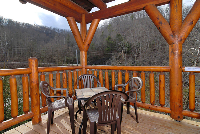 pigeon forge cabin with unique bridge and waterfall view