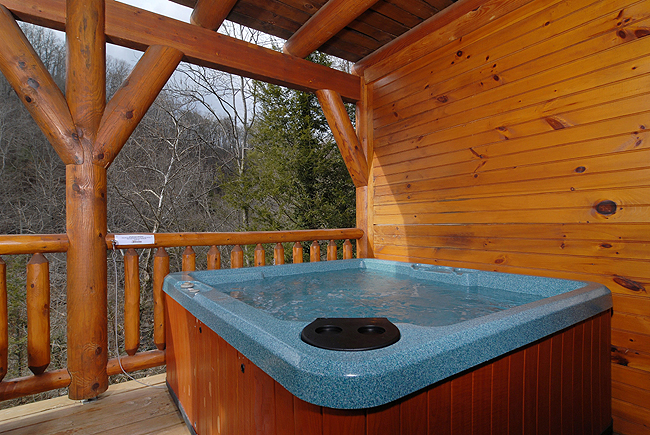 pigeon forge cabin with hot tub overlooking the river