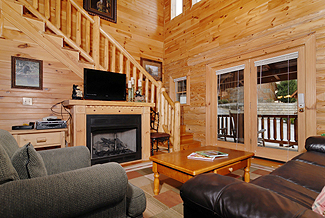 cabin living room with flat screen tv