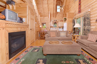 Tennessee Vacation Cabin Rental that features a nice seating area and television above the gas firplace