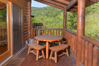 Pigeon Forge Cabin Rental Picnic table while relaxing on the covered porch.