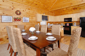 Pigeon Forge Cabin with a dining area overlooking the fully equipped kitchen and the living room
