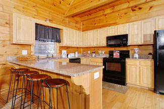 Pigeon Forge Cabin with a Fully Equipped Kitchen with a Dishwasher Microwave and Stove-Oven