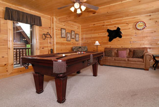 Pigeon Forge Cabin that features a sleeper sofa in the gameroom area