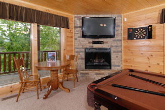 Pigeon Forge Vacation Cabin Rental with pool table, flat screen, and card table.