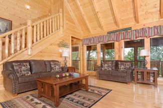 Livingroom Area that has a wooded view and comforable furniture