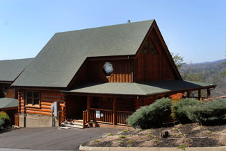 Two Bedroom Log Cabin ina resort with indoor and outdoor swimming pool access and a putt putt course
