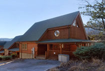 Two Bedroom Log Cabin ina resort with indoor and outdoor swimming pool access and a putt putt course