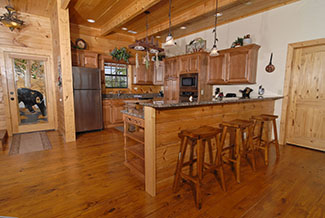 Deluxe kitchen that features a microwave,coffee maker, and a dishwasher with all wood interior