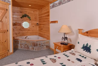 Pigeon Forge Four Bedroom Cabin Rental Master Suite Area with a Whirlpool