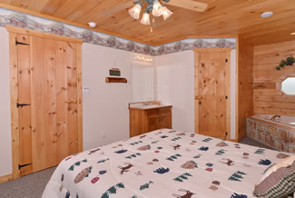 Pigeon Forge Four Bedroom Chalet Rental Master Suite With a Whirlpool Shower and Bathroom