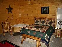 Spacious master bedroom with king bed and indoor whirlpool