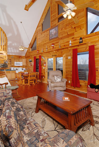 Pigeon Forge Cabin with a vaulted ceiling livingroom area and hardwood floors
