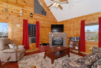 Pigeon Forge Cabin Living Room with a gas fireplace and a flat screen tv for enjoyment