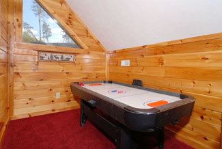 Pigeon Forge Cabin that features an airhockey table in the upper level loft