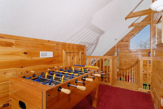 Pigeon Forge Cabin that has a Foosball Table in the Upper Loft Area