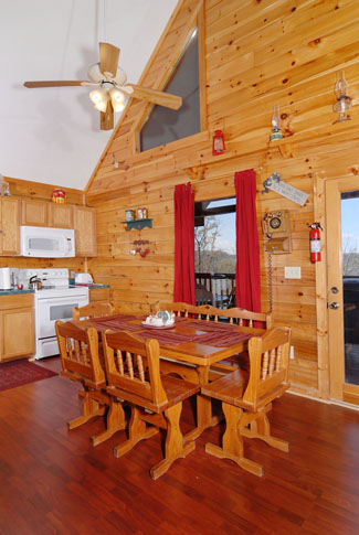 Pigeon Forge Cabin that features vaulted ceilings in the dinning room area that seats six guests