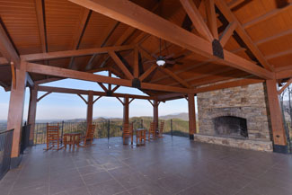 Pigeon Forge Luxury Resort The Preserve Outdoor Covered Seating Area- Panoramic Mountain Views-Outdoor Wood Fireplace Overlooking a Pigeon Forge Mountain View