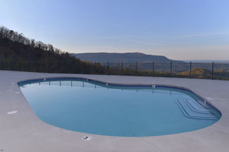 The Preserve Resort Seasonal Outdoor Swimming Pool Overlooking a Panoramic Smoky mountain view and a Distant View of the Pigeon Forge Parkway
