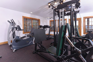 Pigeon Forge Luxury Resort Work Out Facilities Including Free Weights Machines treadmiles and Television for Entertainment
