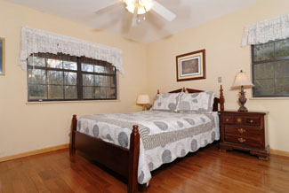 Pigeon Forge Two Bedroom Chalet that features a main master bedroom that features a whirl pool.