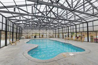 Pigeon Forge Indoor Swimming Pool Area with an outdoor seating area that is convenient to Dollywood and Dolly's Splash Country