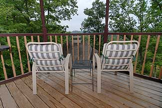 deck overlooking a wooded area