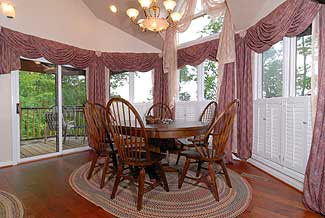 kitchen nook with a wooded view