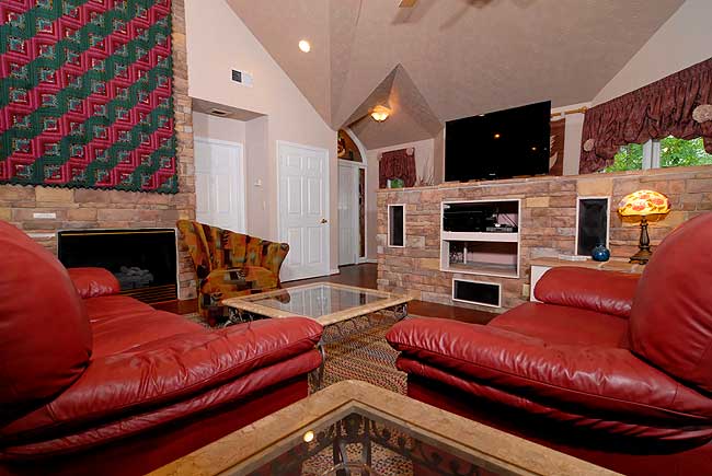 Pigeon Forge Chalet lving room with a gas fireplace