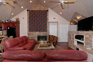 gas fireplace in a cathedral ceiling living room