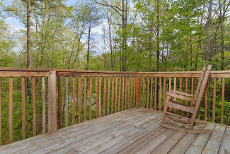 secluded cabin with a wooded view