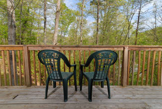 outdoor deck furniture with a wooded view