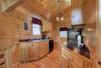 Large living area and kitchen area on the main level of this cabin
