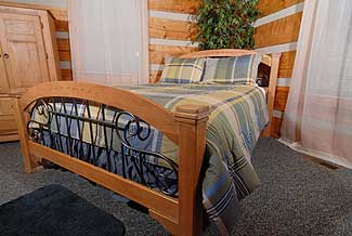 Bedroom with wood and iron bed