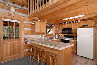 Kitchen with seating for three at the serving bar