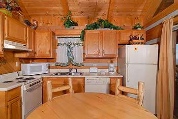 Full kitchen with refrigerator dishwasher stove and microwave