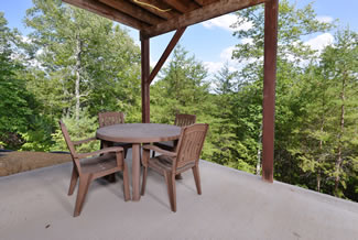 Pigeon Forge Chalet Rental Lower Level Seating Area on the outdoor porch