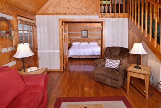 Tennessee Vacation Cabin Rental One Bedroom Cabin That features a walk through to the Livingroom Area