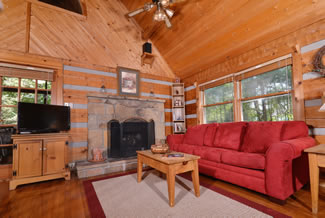 Tennessee Vacation Cabin Rental that features a Fireplace Flat Screen Television Queen Size Sleeper Sofa in the living Area