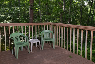 Pigeon Forge Cabin Rental Outdoor Seating Area on the uncovered porch area