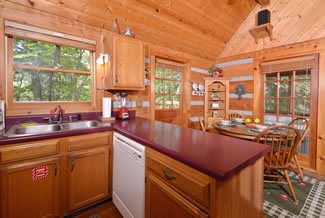 Pigeon Forge One Bedroom Cabin Rental Fully Equipped Kitchen Leading to the Dinning Room