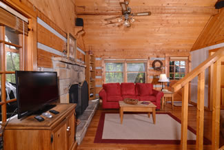 Pigeon Forge One Bedroom Cabin that features a flat screen television in the living room